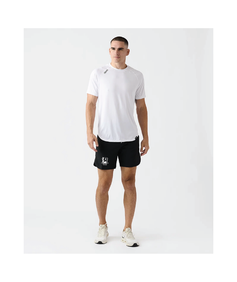 Man wearing a white t-shirt and black shorts on a white background