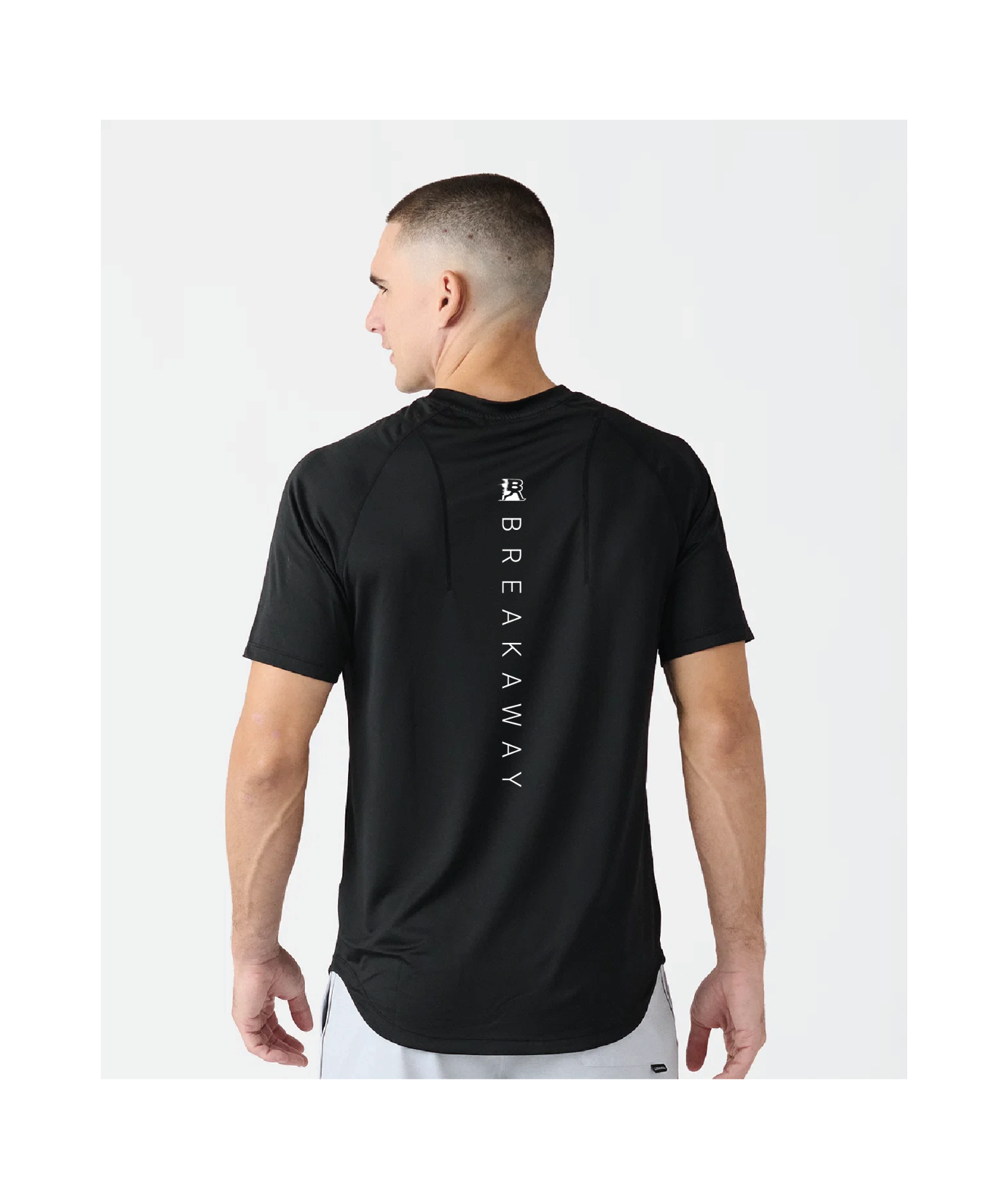 Man wearing a black athletic shirt on a white background